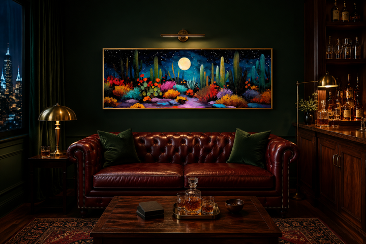 Southwest desert cacti under moon and starry sky long horizontal canvas wall art in a dark room.
