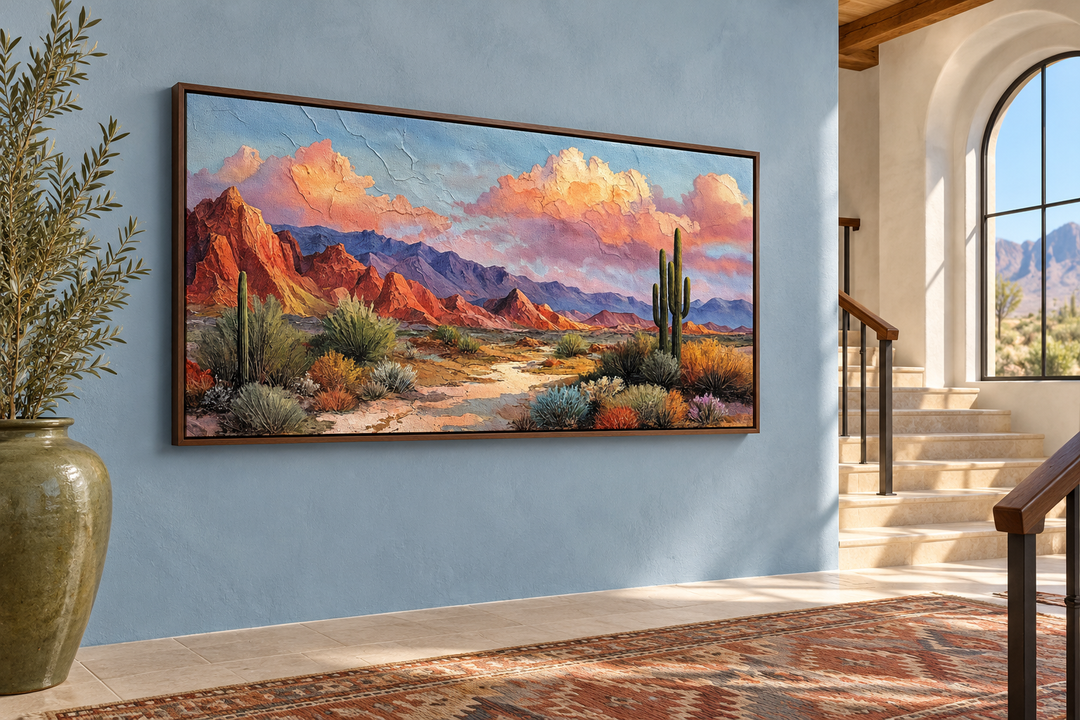 Southwest desert landscape canvas print in a walnut frame on a blue wall by a staircase.