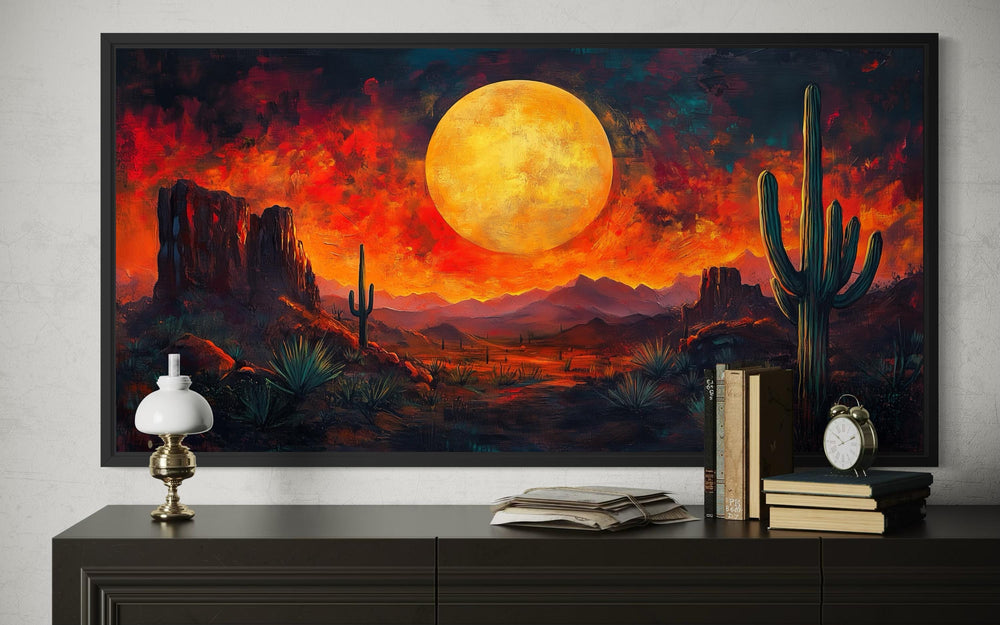 Southwest desert wall art featuring a dramatic red sunset canvas print with cactus silhouettes.