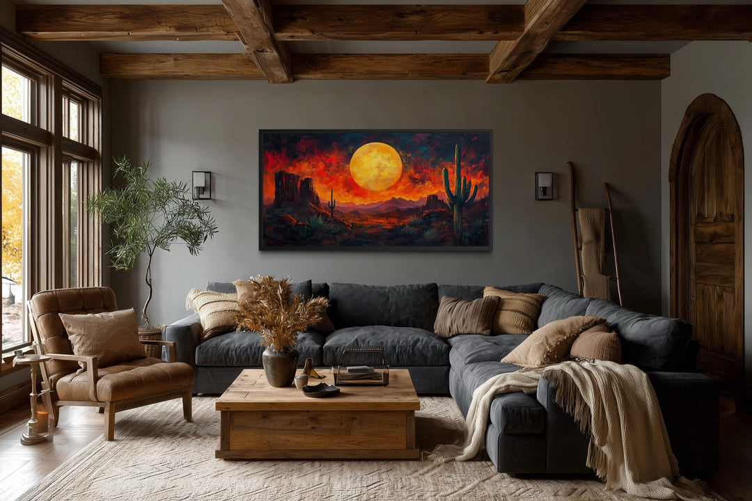 Southwest desert wall art featuring a dramatic red sunset canvas print with a cactus silhouette.