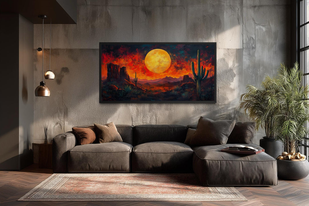 Southwest desert wall art featuring a dramatic red sunset and cactus silhouette in a modern room.