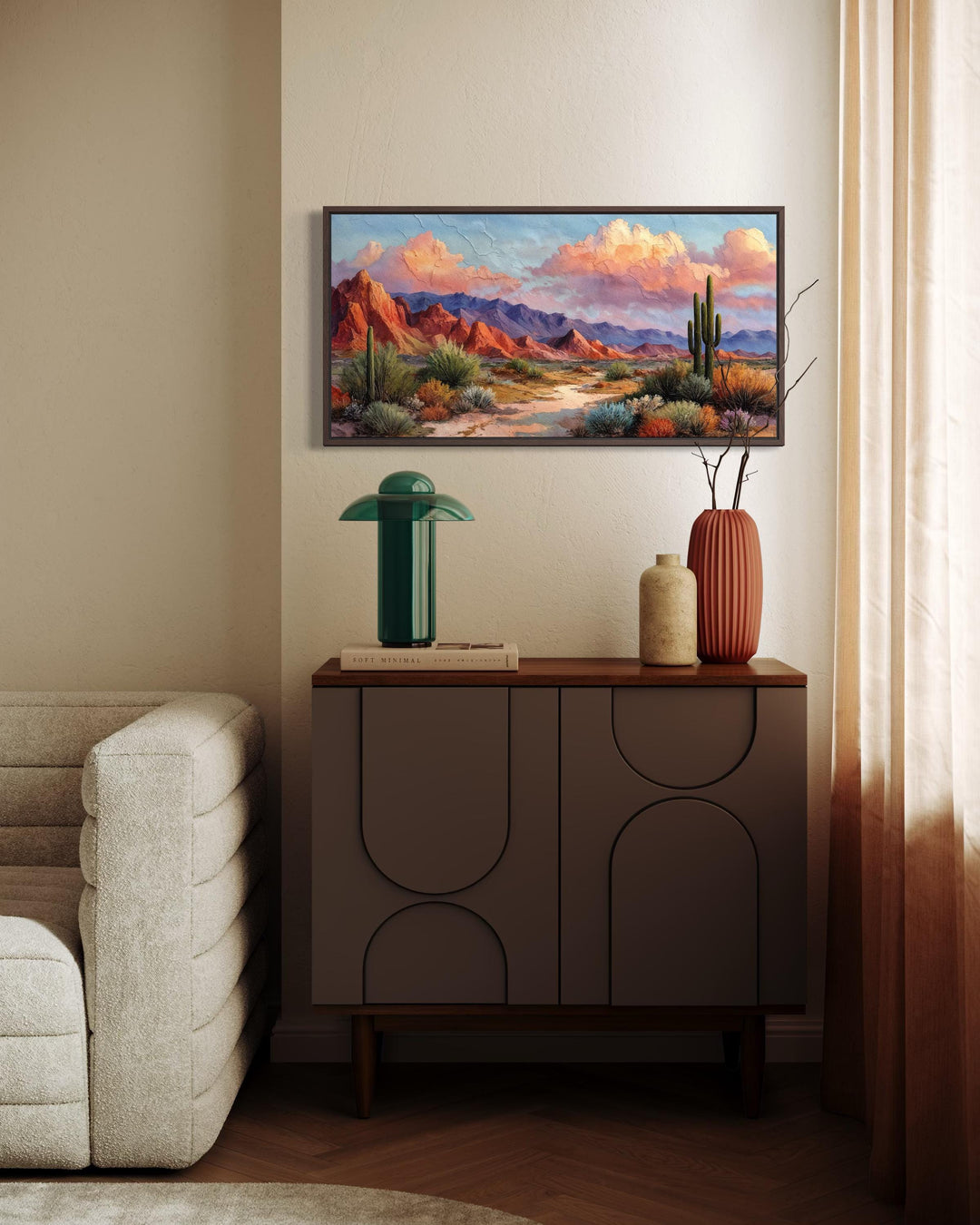 A horizontal canvas print of a vibrant Southwest desert landscape hangs above a modern sideboard.
