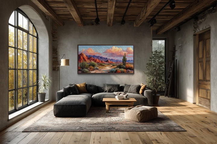 A rustic horizontal canvas print of a vibrant Southwest desert landscape in a modern living room.