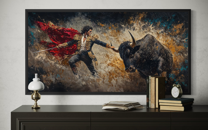Spanish matador fighting a bull canvas wall art displayed above a dark wood dresser.