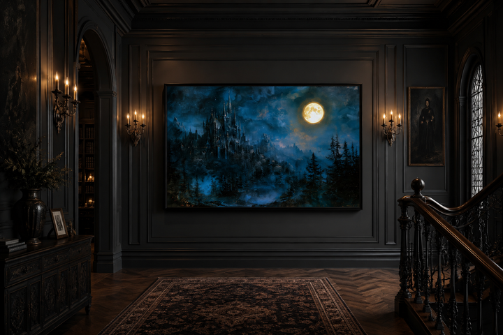 Framed navy blue wall art of a gothic haunted castle under a full moon in a dark, moody room.