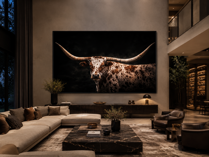 Spotted Texas Longhorn canvas wall art with floating frame in a modern rustic living room.