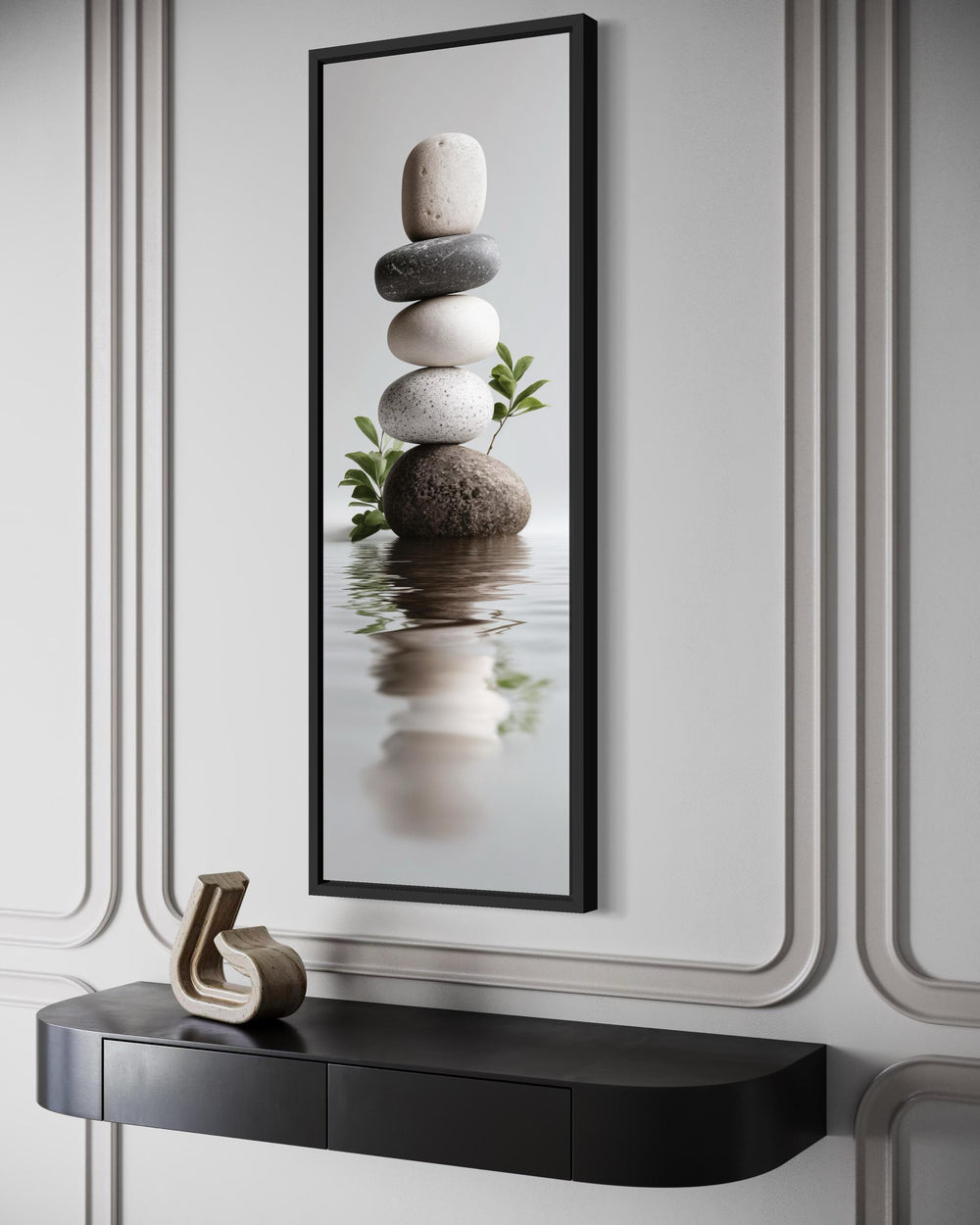 Tall narrow canvas wall art featuring a balanced stack of zen stones reflected in calm water.