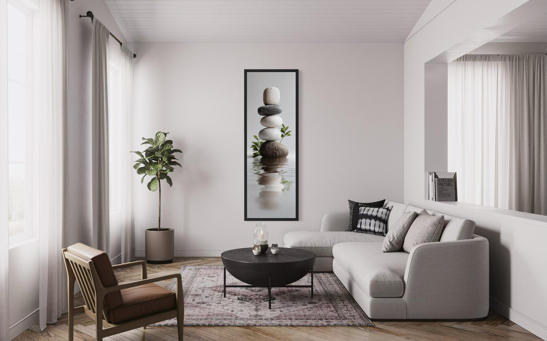 Stacked Zen stones tall narrow canvas wall art in a minimalist modern living room.