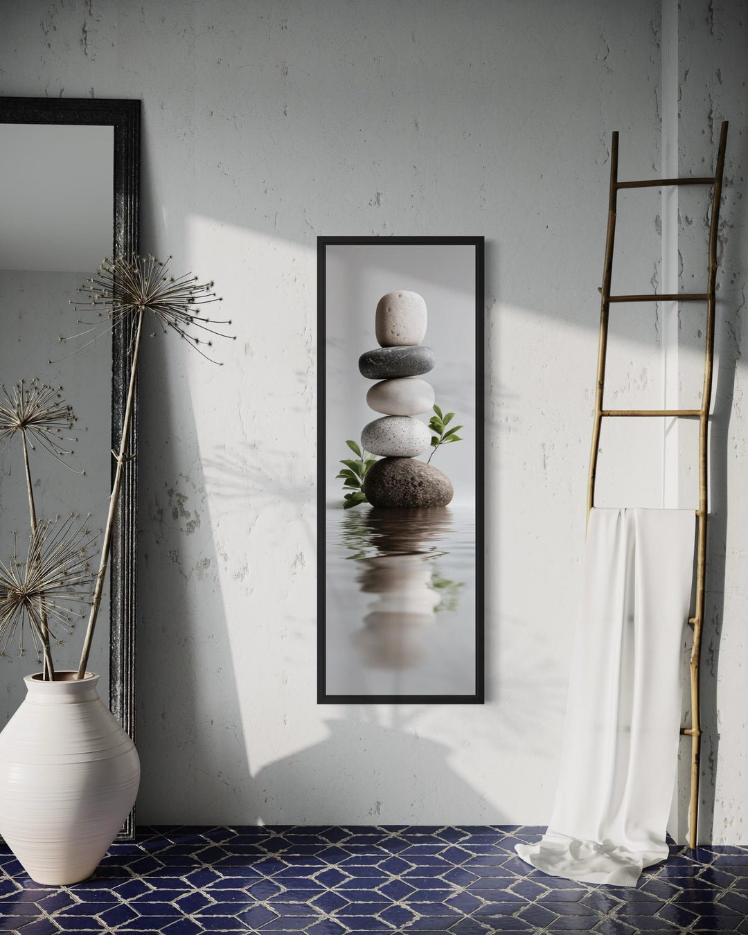 Tall narrow canvas wall art featuring a balanced stack of zen stones over a calm water reflection.