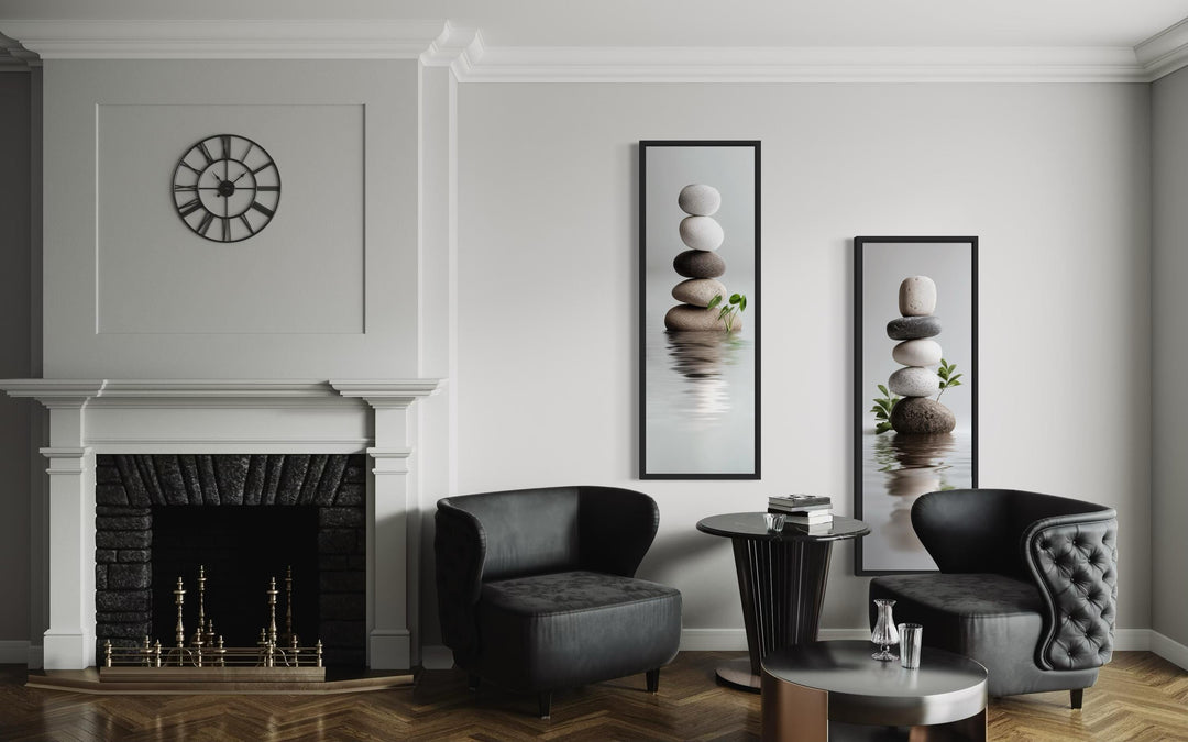 Set of two tall, narrow canvas prints featuring stacked zen stones in a modern minimalist room.