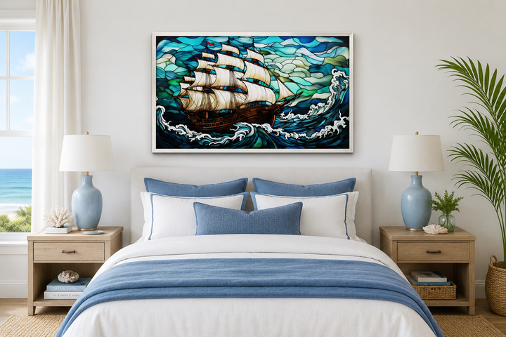 Pirate ship stained glass style framed canvas wall art hanging above a bed in a nautical bedroom.
