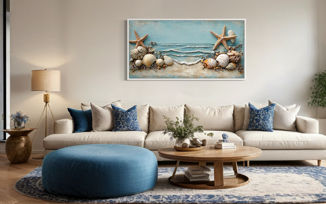 Framed canvas wall art featuring starfish and seashells in soft blue and sandy beige tones.