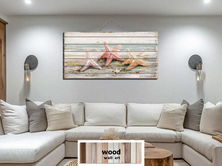 Large horizontal wood wall art featuring three starfish on a beach, ideal for coastal home decor.