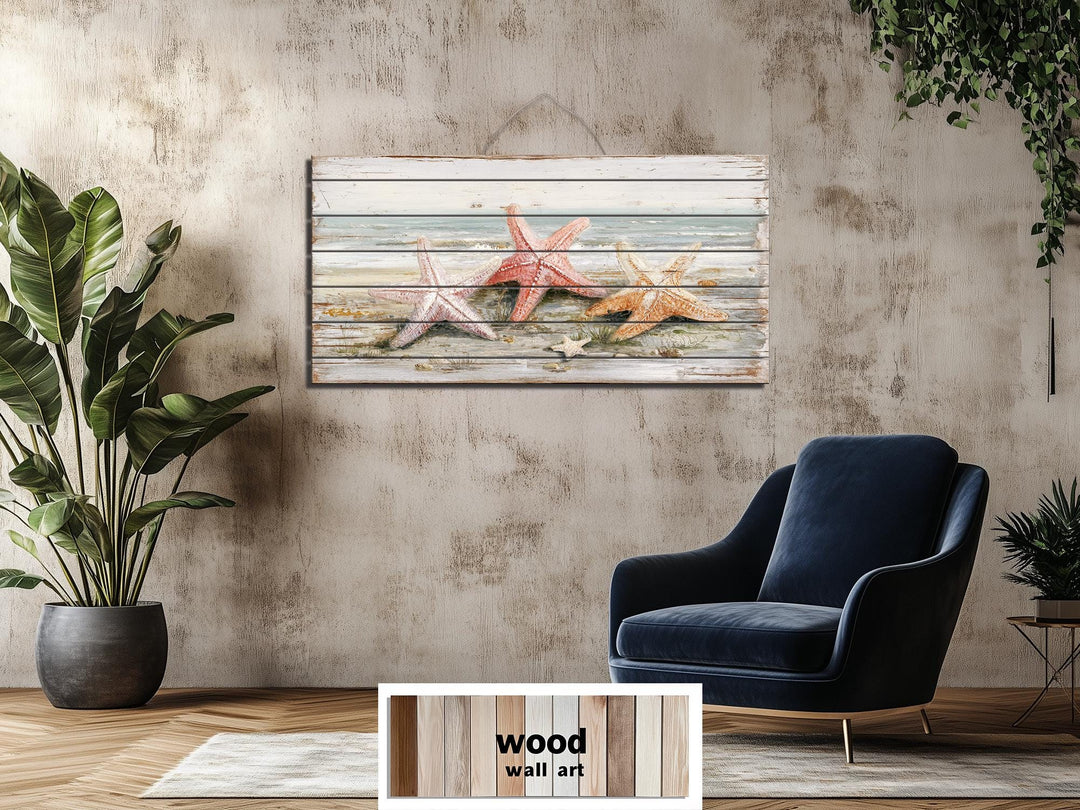 Large horizontal wood wall art featuring three starfish on a beach, hanging in a modern living room.