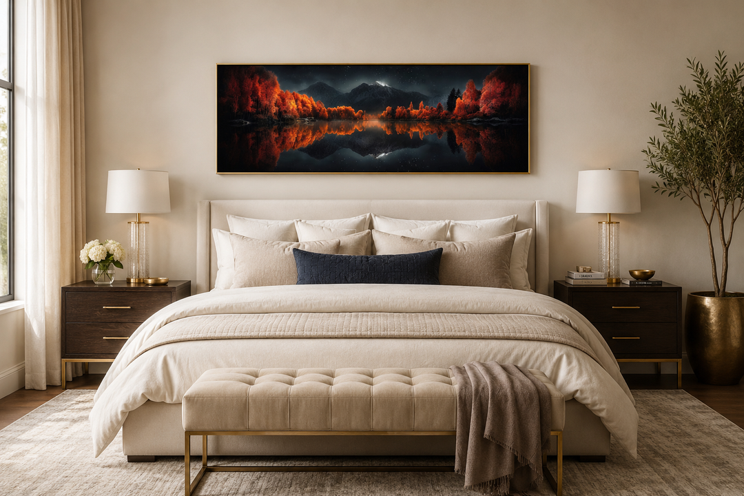 Panoramic wall art of a starry night sky over a reflective autumn lake above a modern bed.