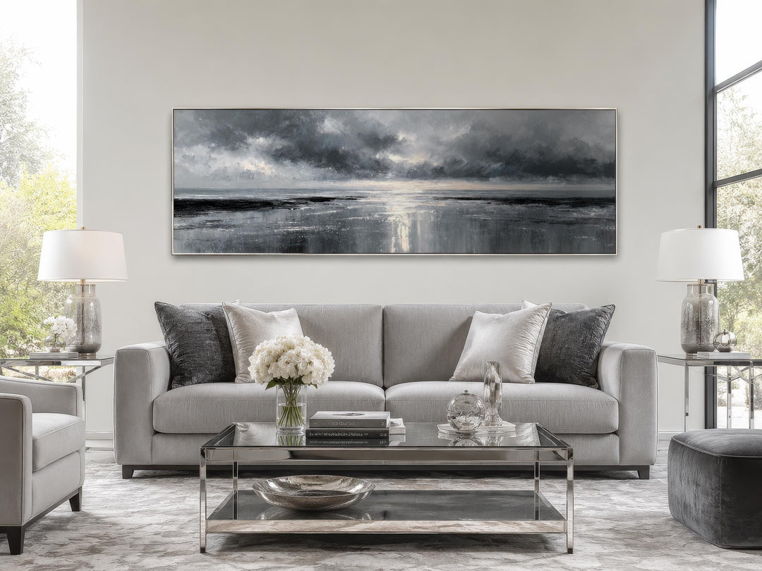 Stormy Ocean wall art in a grey and silver living room with a sofa and glass coffee table.