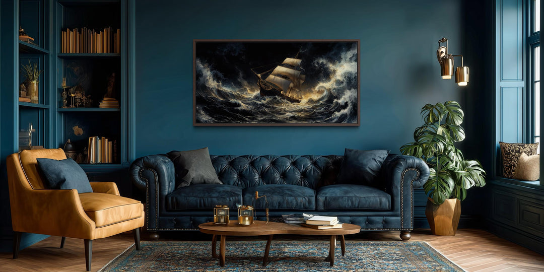 Stormy sailing ship wall art featuring a dramatic ocean waves canvas print in a moody living room.
