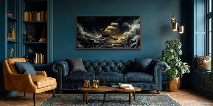 Stormy sailing ship wall art featuring a dramatic ocean waves canvas print in a moody living room.