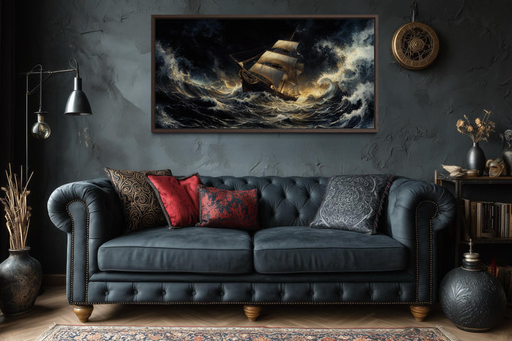 Stormy sailing ship wall art featuring dramatic ocean waves in a dark, moody living room setting.