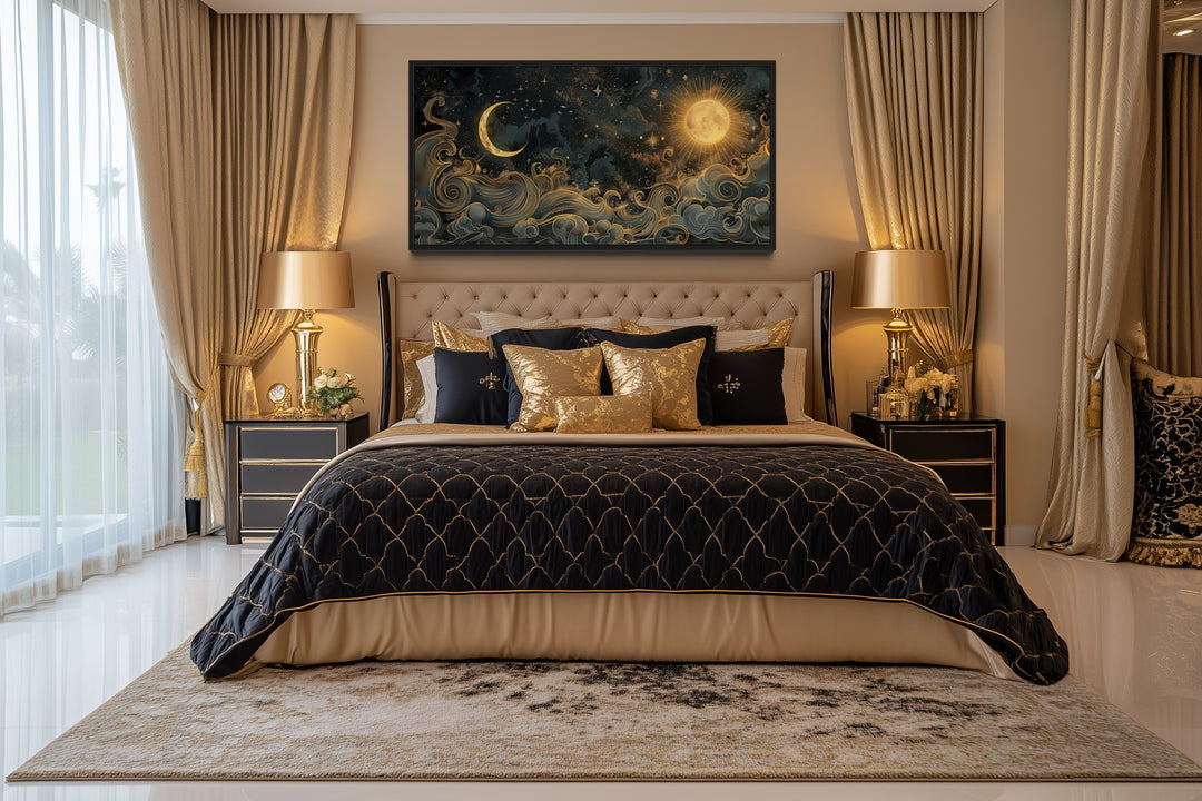 Framed black and gold celestial canvas art of a sun and moon hanging above a bed in a bedroom.