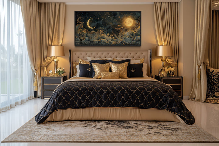 Framed black and gold celestial canvas art of a sun and moon hanging above a bed in a bedroom.