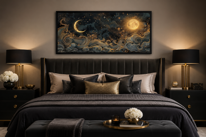 Framed black and gold celestial canvas art featuring a sun, moon, and stars above a dark bed.