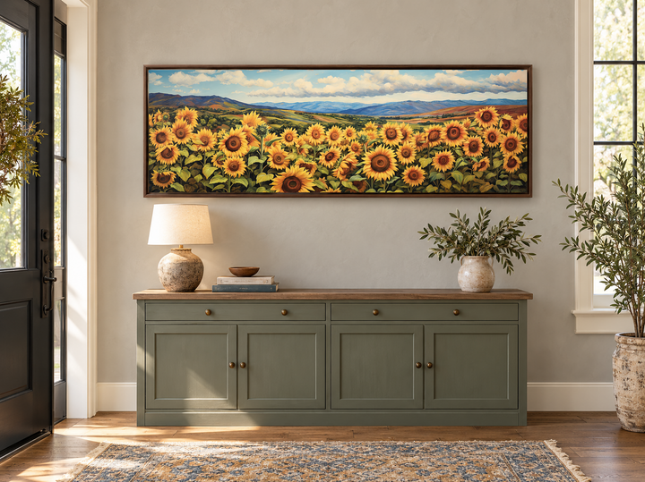Sunflowers field rustic farmhouse long horizontal wall art in a brown frame above a green sideboard.