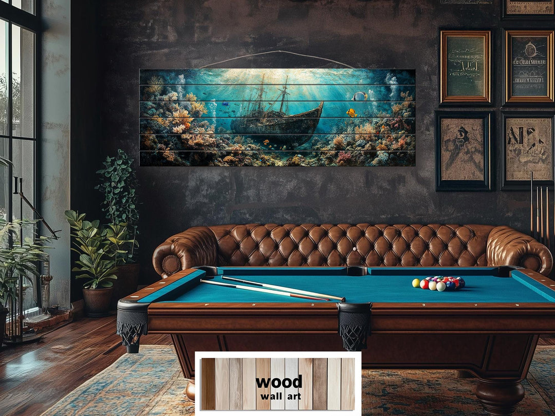 Sunken shipwreck distressed wood wall art featuring a nautical scene above a pool table.