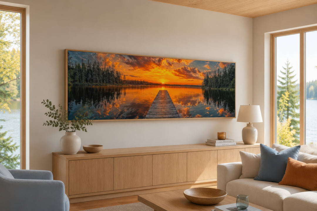 Sunrise over lake and fishing pier long horizontal canvas wall art above a wooden console table.