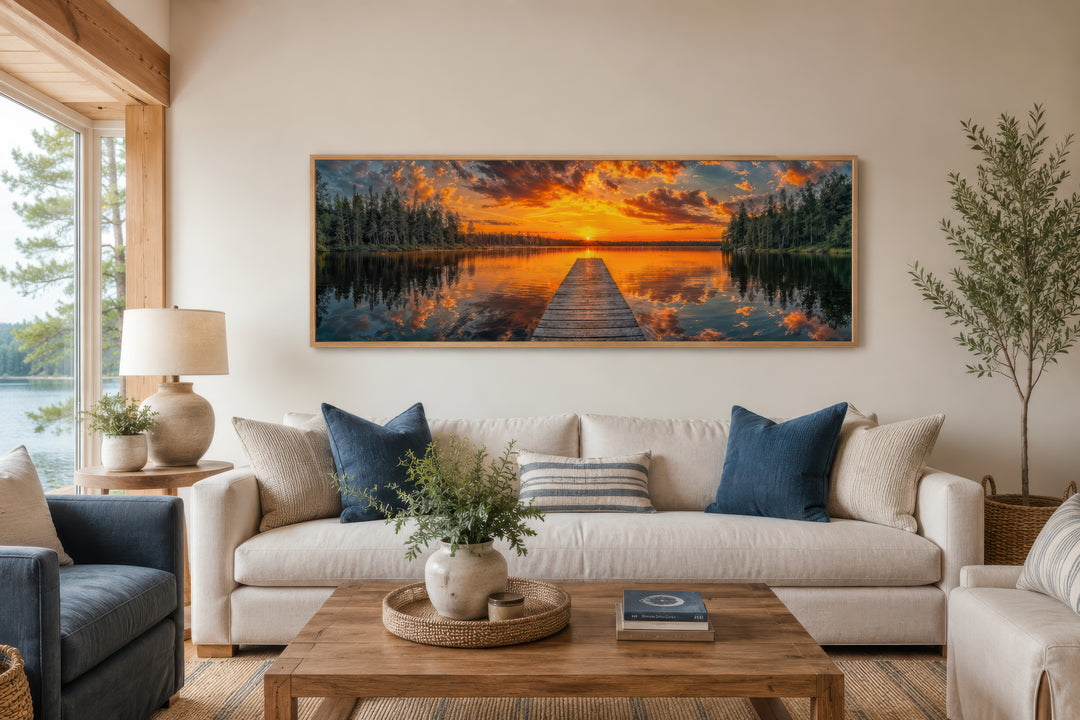 Sunrise Over Lake And Fishing Pier Long Horizontal Canvas Wall Art above a sofa in a living room.