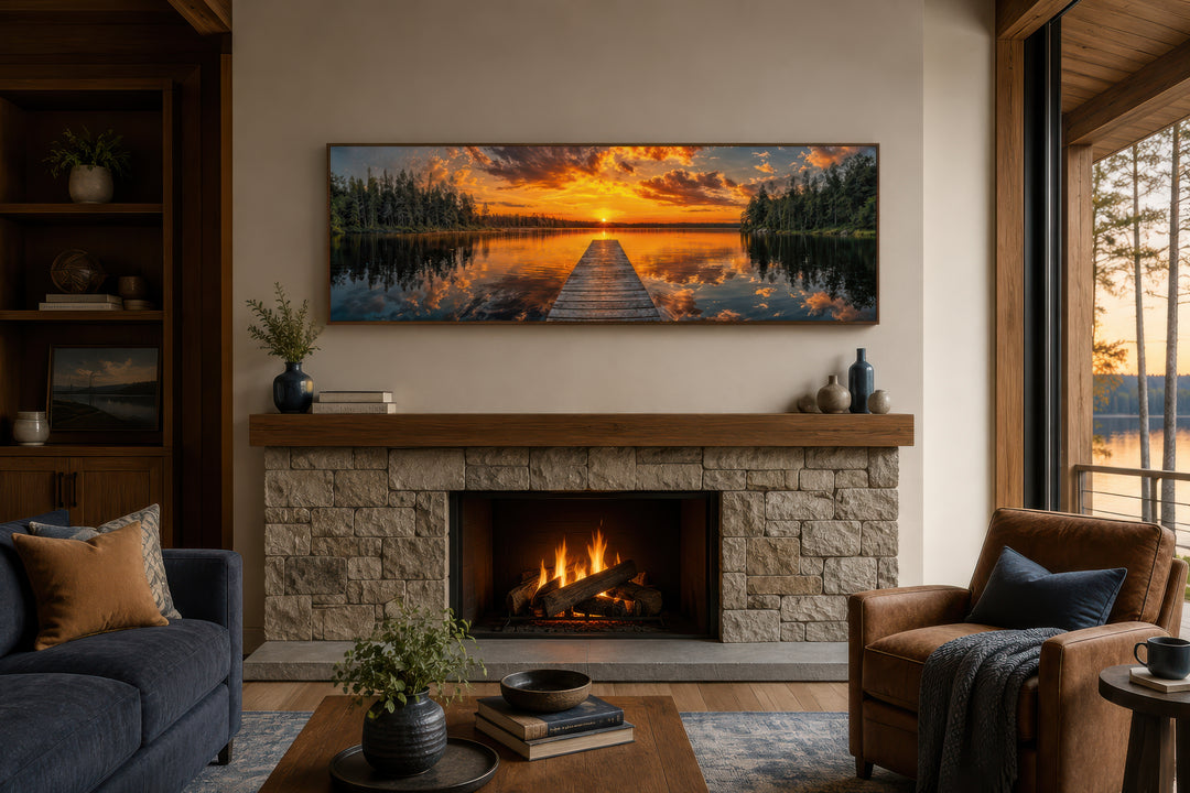Sunrise over lake and fishing pier long horizontal canvas wall art hanging above a stone fireplace.