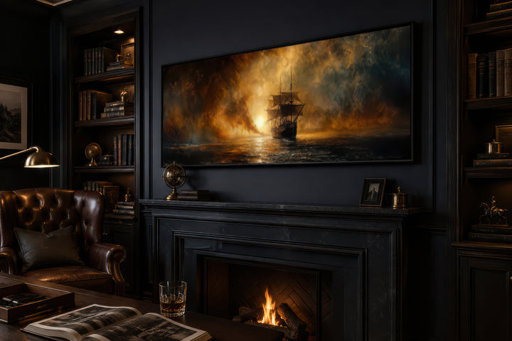 Sunset sailing ship long horizontal canvas wall art above a fireplace in a dark, classic room.