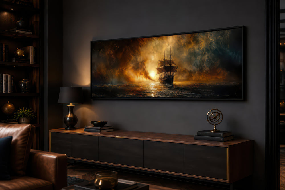 Sunset sailing ship horizontal canvas wall art in a dark, modern living room above a wooden console.