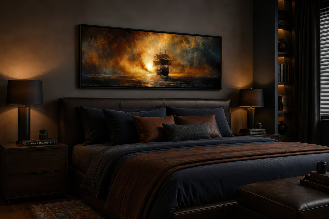 Sunset sailing ship canvas wall art in a dark bedroom above a leather headboard.