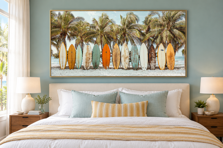 Surfboards On The Beach Framed Canvas Wall Art hanging above a bed in a coastal bedroom.