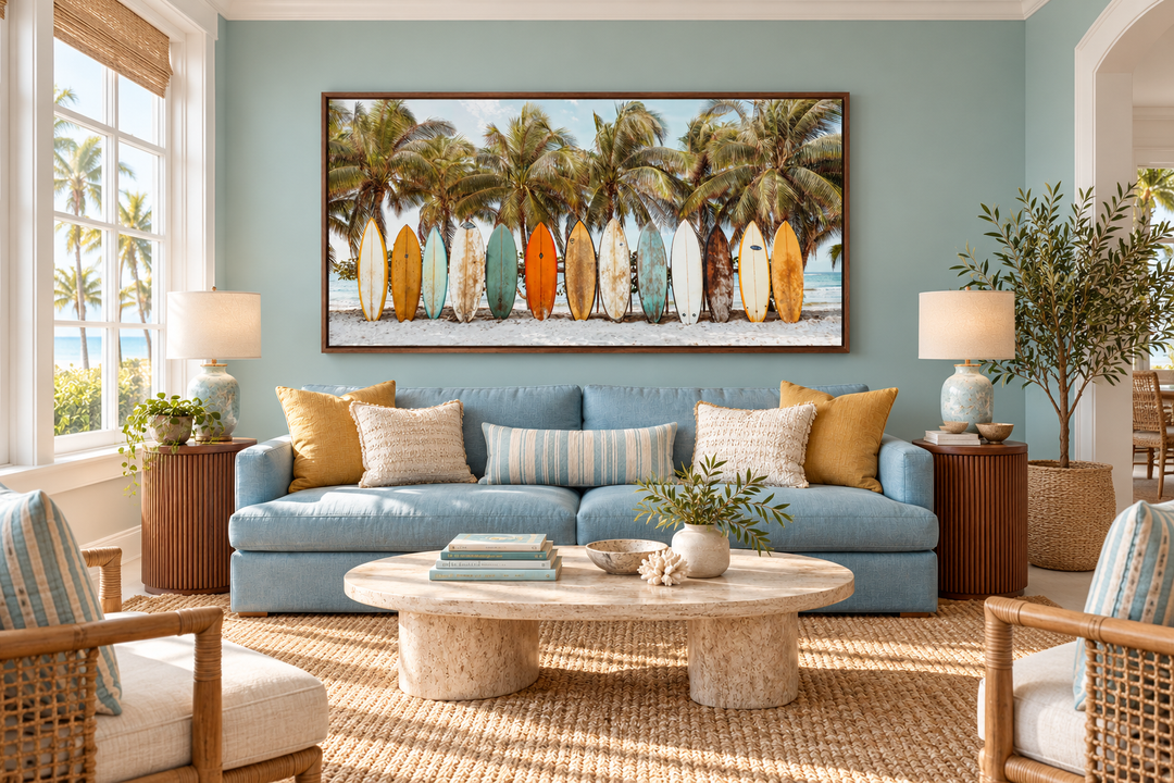 Surfboards on the Beach framed canvas wall art above a blue sofa in a coastal living room.