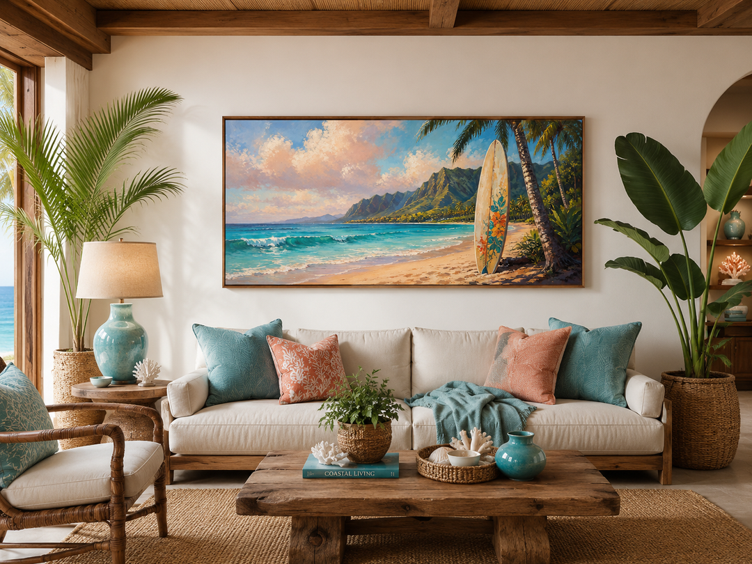 Framed canvas wall art of a surfboard on a Hawaiian beach at sunset above a white sofa.