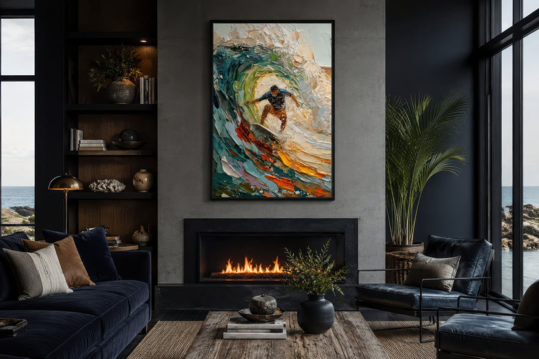 A framed impressionistic canvas of a surfer riding a colorful wave hangs above a modern fireplace.