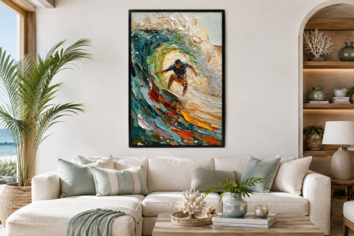 A framed impressionistic canvas painting of a surfer riding a colorful, textured wave.