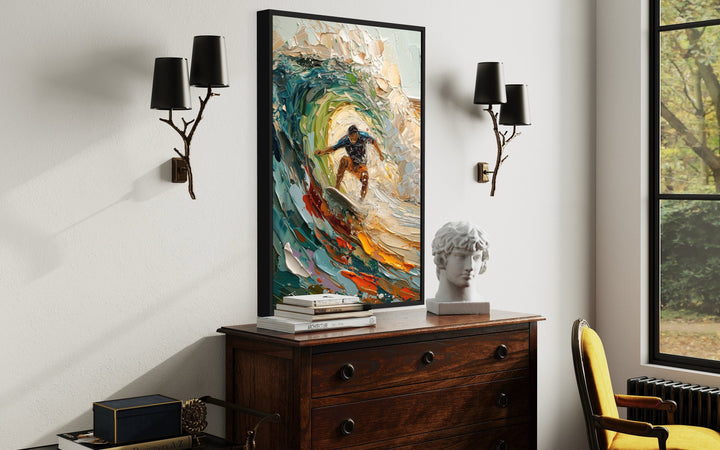 Impressionistic framed canvas wall art of a surfer riding a colorful, textured wave.