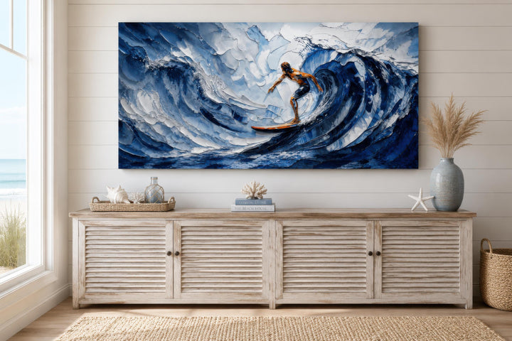 Horizontal canvas print of a surfer on a large blue wave above a white coastal sideboard.