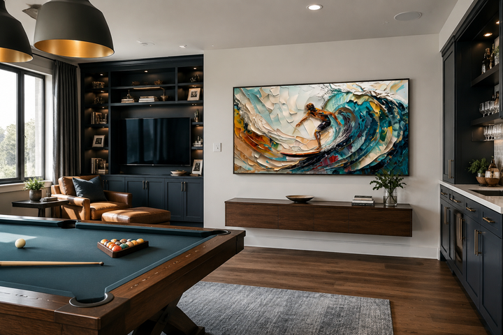 Abstract surfing wall art of a surfer on a vibrant blue wave in a modern game room setting.