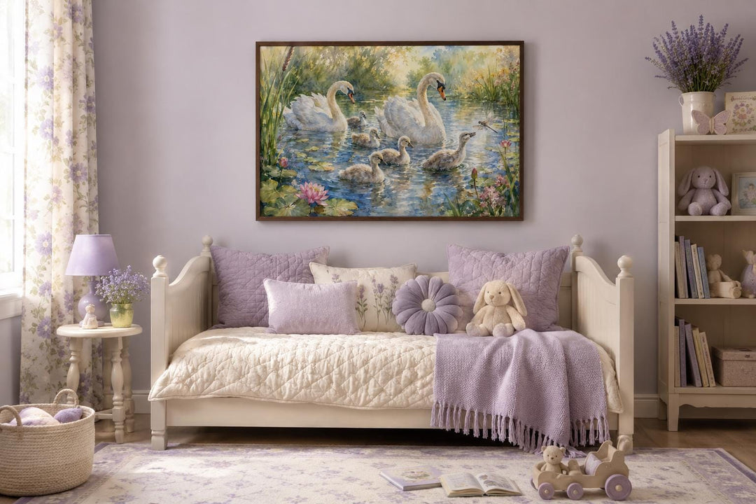 Framed canvas art of a swan family with cygnets on a pond, hung in a lavender-themed nursery.