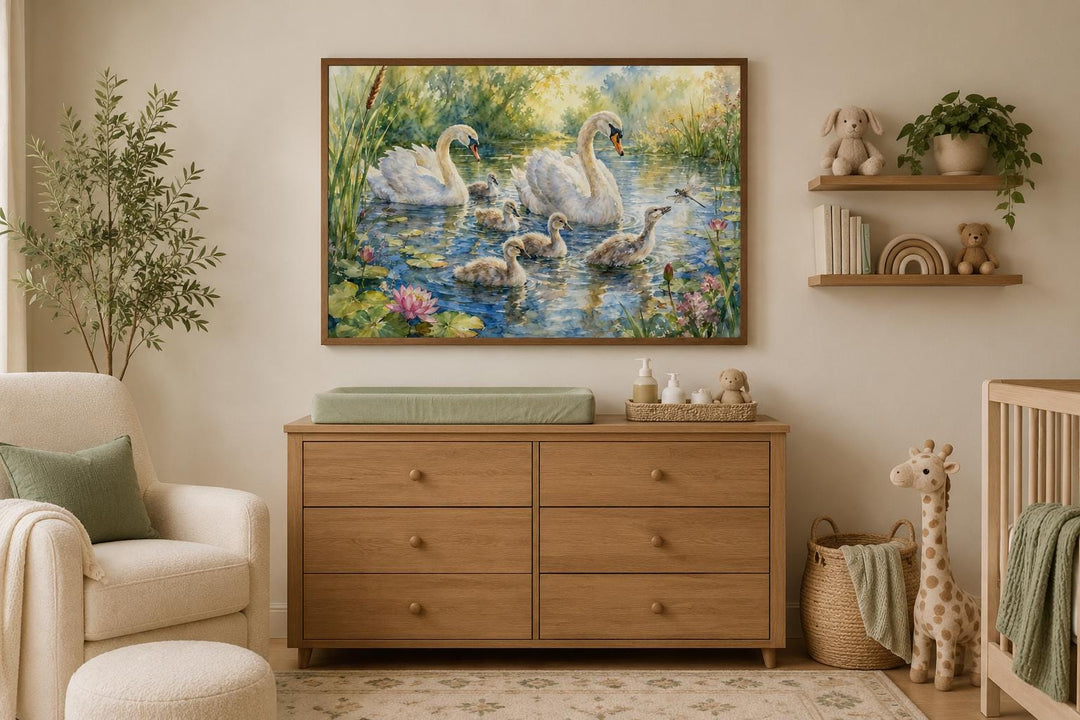 Swan family with baby cygnets canvas wall art hanging in a neutral-toned nursery.