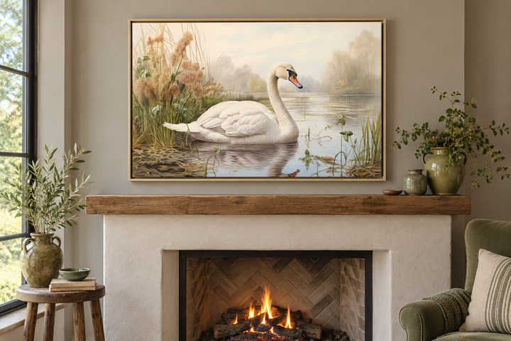 Vintage-style framed canvas art of a white swan on a lake, hung above a rustic fireplace mantel.
