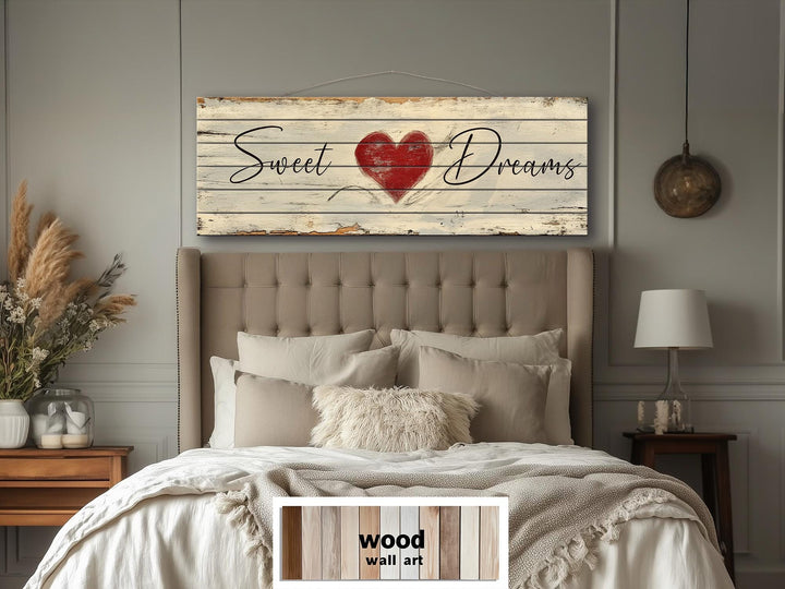 Rustic wood wall art featuring Sweet Dreams script and a red heart above a neutral bedroom set.