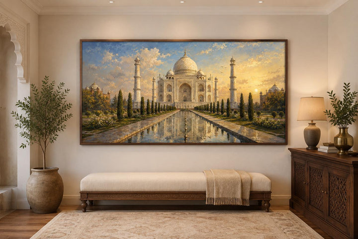 Wide horizontal canvas wall art of the Taj Mahal at sunrise above a bench in an elegant room.