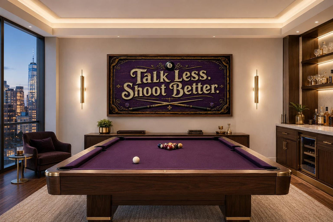 Talk Less Shoot Better vintage pool hall sign in purple and gold above a pool table in a game room.