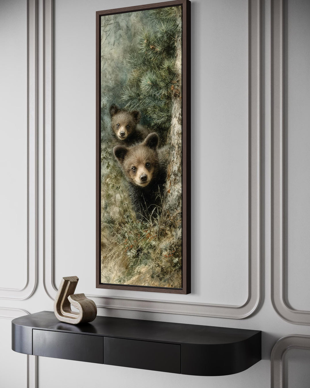 Tall narrow canvas wall art of two baby bear cubs peeking from a pine tree in a modern room.