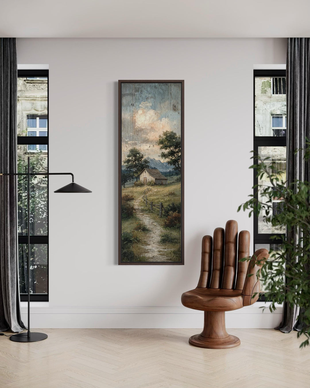 Tall narrow rustic barn landscape wall art in a vertical frame on a white wall.